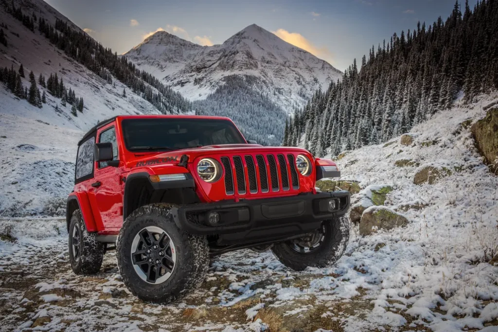 Jeep Wrangler Rubicon Off-Roading on a Snowy Mountain