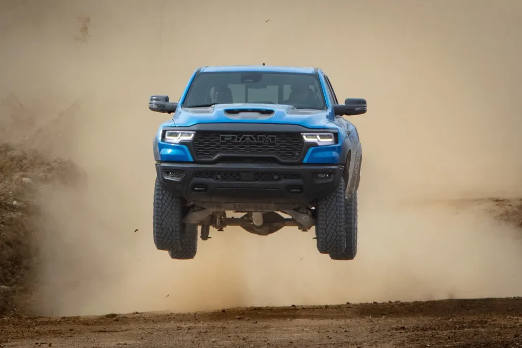 Ram 1500 Catching Air Off-Roading in a Desert Front View