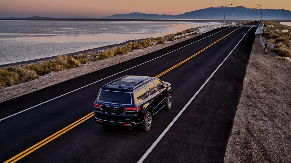 2022 Grand Wagoneer dark blue coastal road