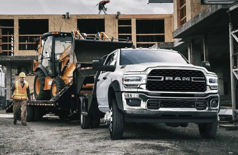 2023 Ram Chassis Cab towing trailer with tractor